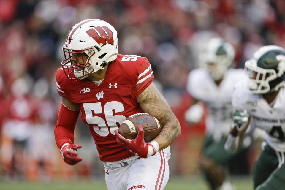 Wisconsin linebacker Zack Baun (56) rhad a long wait before he was drafted. (AP Photo/Andy Manis)