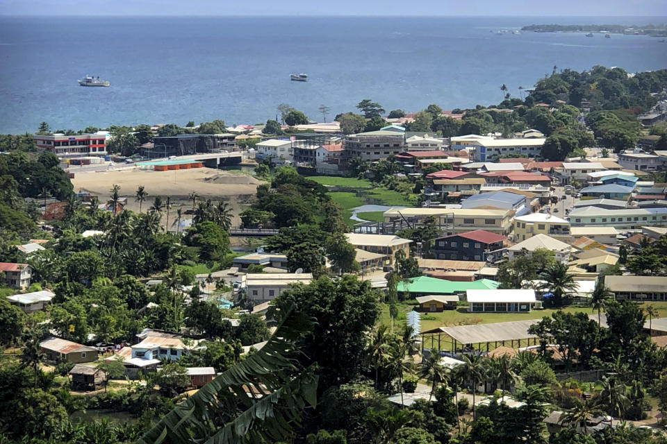 File - Ships are docked offshore in Honiara, the capital of the Solomon Islands, Nov. 24, 2018. The Solomon Islands switched diplomatic recognition from Taiwan to China on Monday, Sept. 16, 2019, becoming the latest country to leave the dwindling Taiwanese camp. China wants 10 small Pacific nations to endorse a sweeping agreement covering everything from security to fisheries in what one leader warns is a “game-changing” bid by Beijing to wrest control of the region. (AP Photo/Mark Schiefelbein, File)
