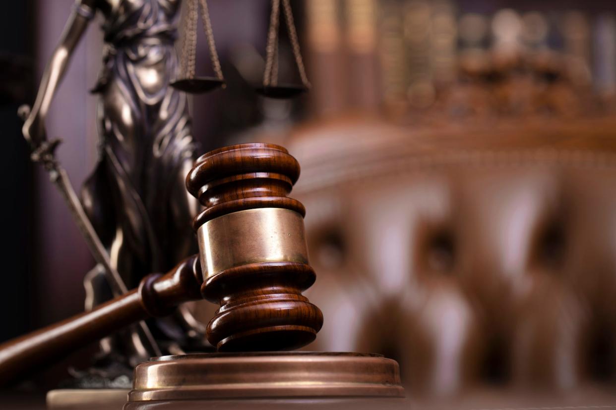 Stock photo from inside a courtroom, featuring a gavel.