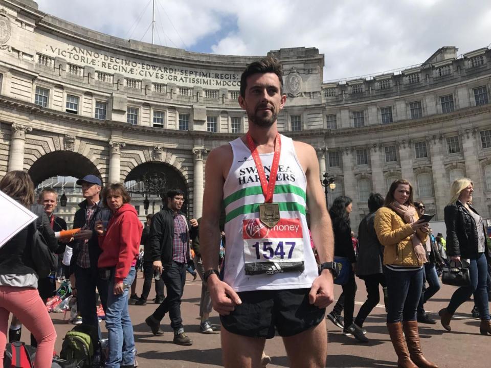 Helping hand: Matthew Rees with his medal (PA)