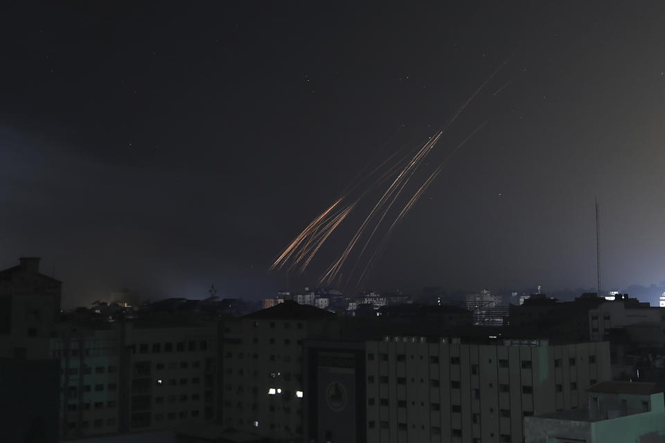 Tails of fire caused by Israeli bombardment, fall over Gaza City, Saturday, Nov. 4, 2023. (AP Photo/Abed Khaled)