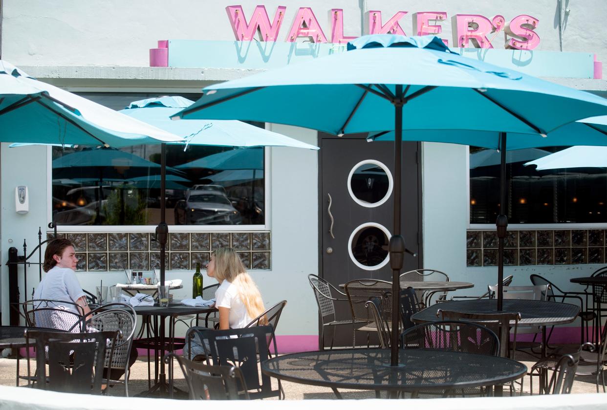 Sarah Tramel, left, Austin Bourn dine at Walker's Drive-In on State Street in Jackson in 2021.