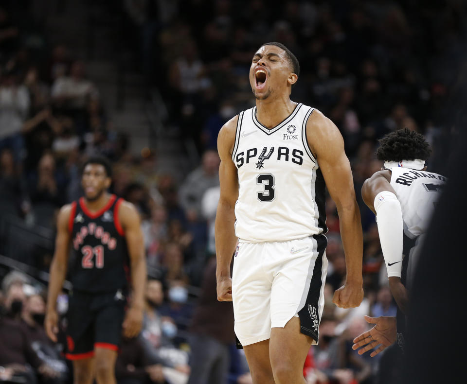 SAN ANTONIO, TX - MARCH 9: Keldon Johnson #3 of the San Antonio Spurs reacts after hitting a three-pointer against the Toronto Raptors in the second half at AT&amp;T Center on March 9, 2022 in San Antonio, Texas. NOTE TO USER: User expressly acknowledges and agrees that, by downloading and or using this photograph, User is consenting to terms and conditions of the Getty Images License Agreement. (Photo by Ronald Cortes/Getty Images)