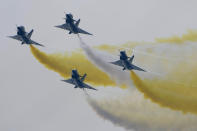 Members of the "August 1st" Aerobatic Team of the Chinese People's Liberation Army (PLA) Air Force perform during the 13th China International Aviation and Aerospace Exhibition, also known as Airshow China 2021, on Tuesday, Sept. 28, 2021, in Zhuhai in southern China's Guangdong province. (AP Photo/Ng Han Guan)