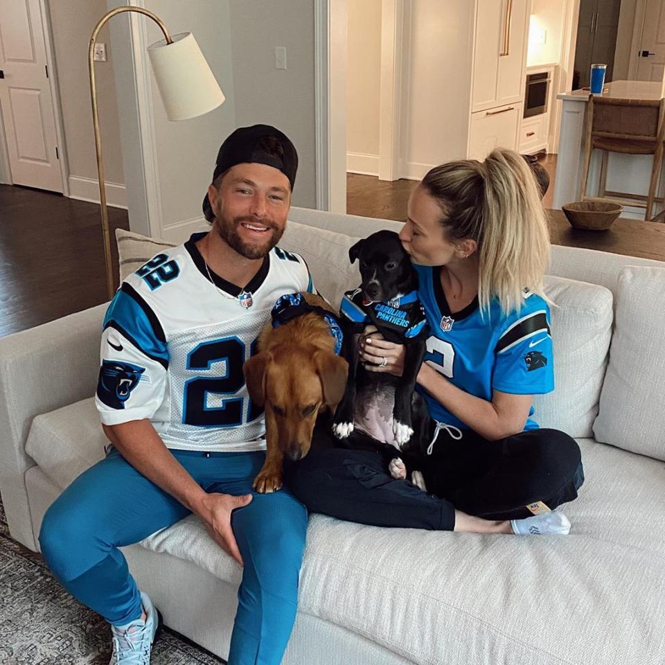 <p>It's game day at the Lane house! The country star and the <em>Bachelor</em> alum got all dressed up (including their two dogs, Cooper and Chloe!) in their Carolina Panthers gear for some Sunday football.</p> <p>"Hot husband and cute lil babies 🏈," Bushnell captioned <a href="https://www.instagram.com/p/CFISSRoBbH4/" rel="nofollow noopener" target="_blank" data-ylk="slk:this photo;elm:context_link;itc:0;sec:content-canvas" class="link ">this photo</a>. </p>