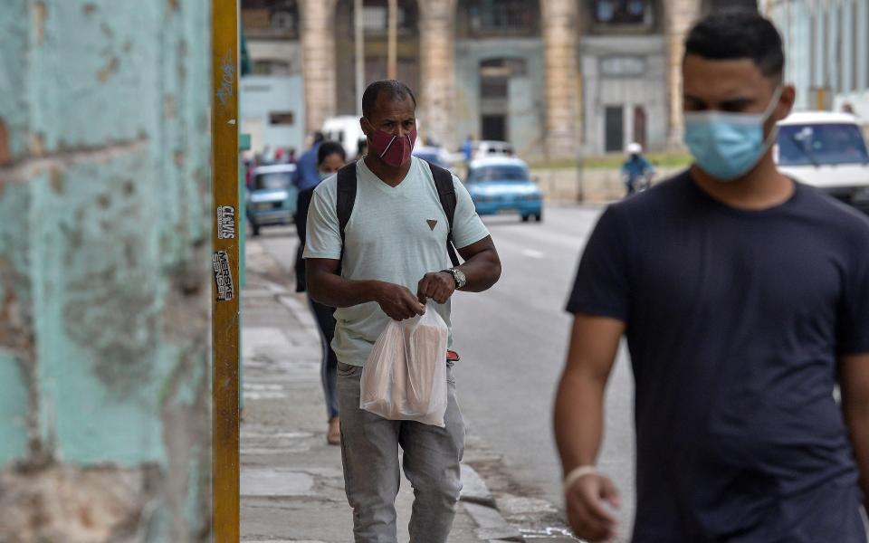 Masks are mandatory on the streets of Havana  - Getty