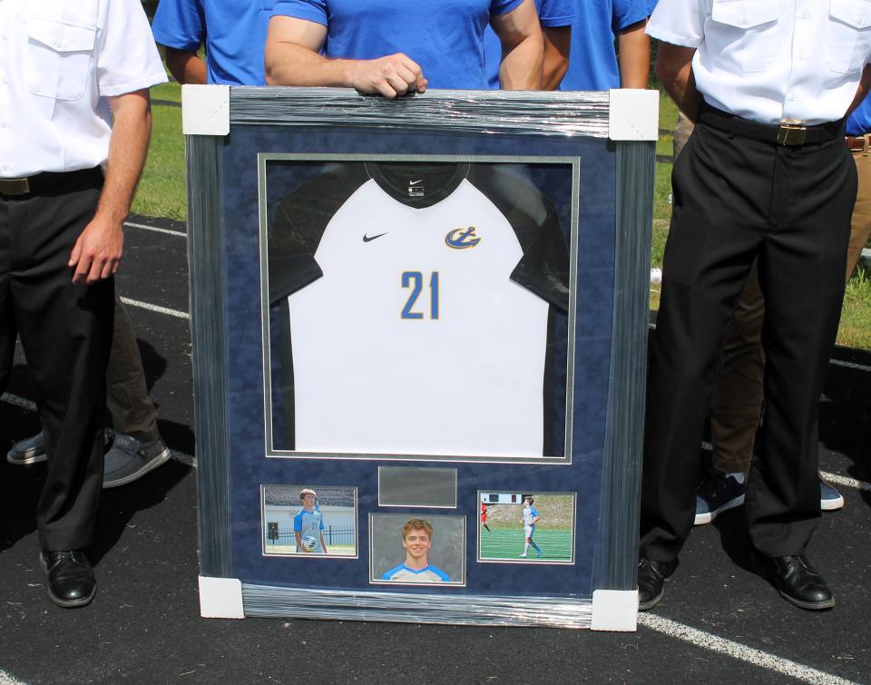 The Maine Maritime Academy men's soccer team presented this framed jersey to the family of the late Brian Kenealy during a solemn ceremony Saturday at York High School.