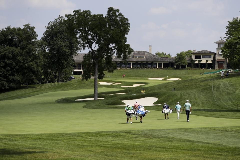 Keith Mitchell, Ryan Armour and Stewart Cink walk up the 18th fairway during opening round of the Workday Charity Open golf tournament, Thursday, July 9, 2020, in Dublin, Ohio. (AP Photo/Darron Cummings)