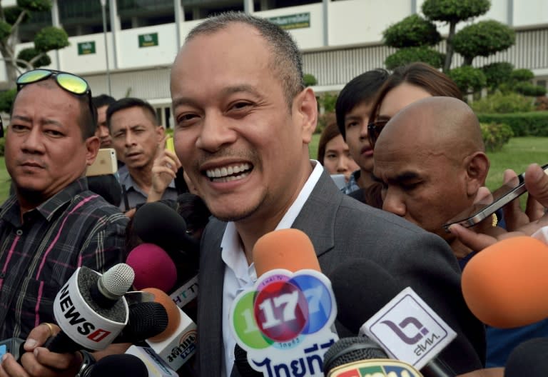 Nattawut Saikuar, secretary-general of the Thai opposition "Red Shirt" movement, smiles while answering a question from the media at the army facility in Bangkok on January 30, 2015