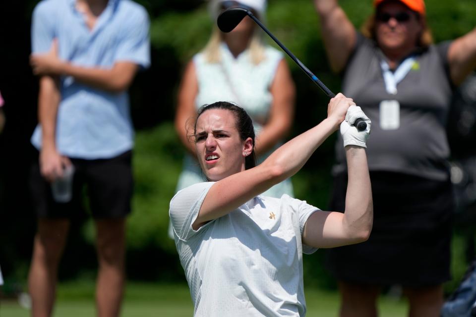 Iowa basketball star Caitlin Clark watches her tee shot during the John Deere Classic pro-am on July 5, 2023.