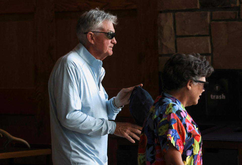 Jerome Powell, chair of the Federal Reserve, and his wife Elissa Leonard walk around Grand Teton National Park, where financial leaders from around the world are gathering for the Jackson Hole Economic Symposium, outside Jackson, Wyoming, U.S., August 25, 2022. REUTERS/Jim Urquhart