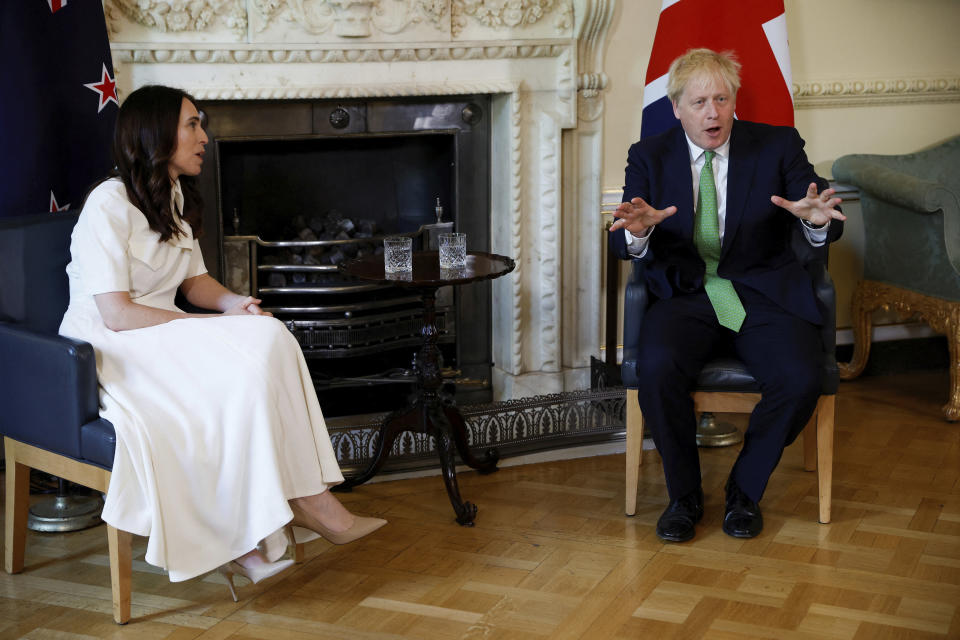British Prime Minister Boris Johnson, right, speaks with New Zealand Prime Minister Jacinda Ardern at Downing Street, in London, Friday July 1, 2022. (John Sibley/Pool Photo via AP)