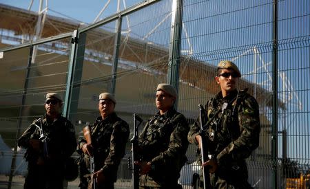 Special police forces stand guard outside the Olympic Park less than two weeks before the start of the Rio 2016 Olympic Games in the Barra da Tijuca neighborhood of Rio de Janeiro, Brazil, July 24, 2016. REUTERS/Pilar Olivares