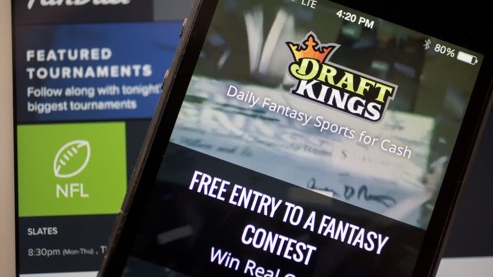 Apps like DraftKings, FanDuel and others let fans place bets in seconds from their phones. - Bloomberg / Getty Images
