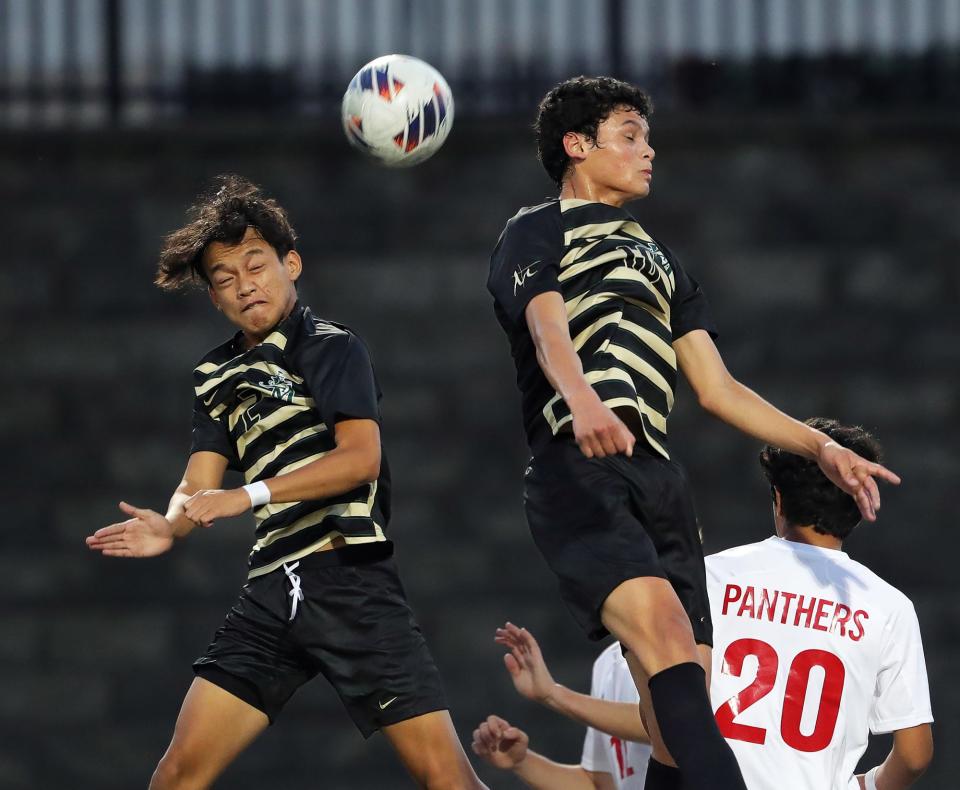 STVM's Ehpe Soe, left, and Diego Pinto, right, both attempt to head a corner kick during the first half of a soccer game against Norton, Thursday, Sept. 8, 2022, in Akron, Ohio.