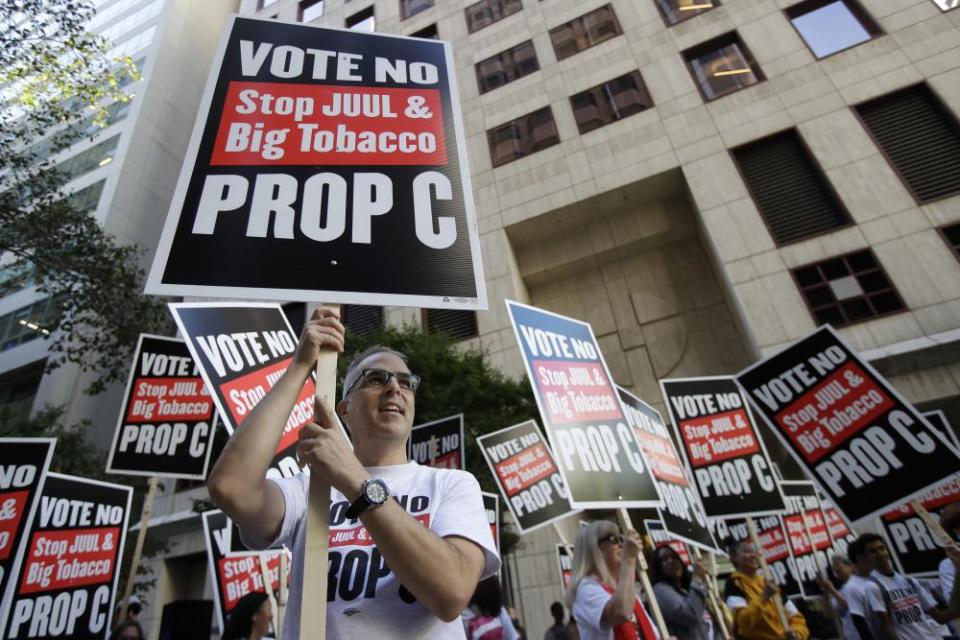 Protesters in San Francisco call for the city-wide ban on vape sales to be upheld.