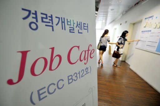 South Korean women looking at job notices at a women's university in Seoul. Desirable jobs in South Korea are dwindling as rapid development gives way to a more measured pace and more youngsters shun small- or mid-sized companies offering lower pay