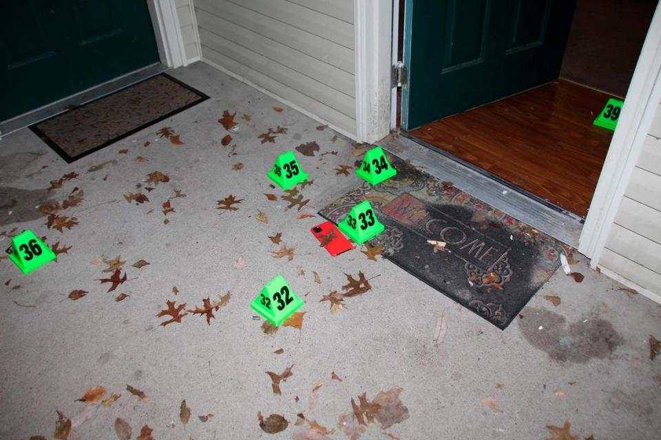 In this crime scene evidence photo released by the Louisville Metro Police Department, Louisville Police marked shell casings are seen at the front door of Breonna Taylor’s apartment after she was fatally shot by police in Louisville, Ky., on March 13, 2020. The Kentucky Attorney General said in October that two long rifle shell casings were also found at the scene after the police raid that killed Taylor. (Louisville Metro Police Department via AP)