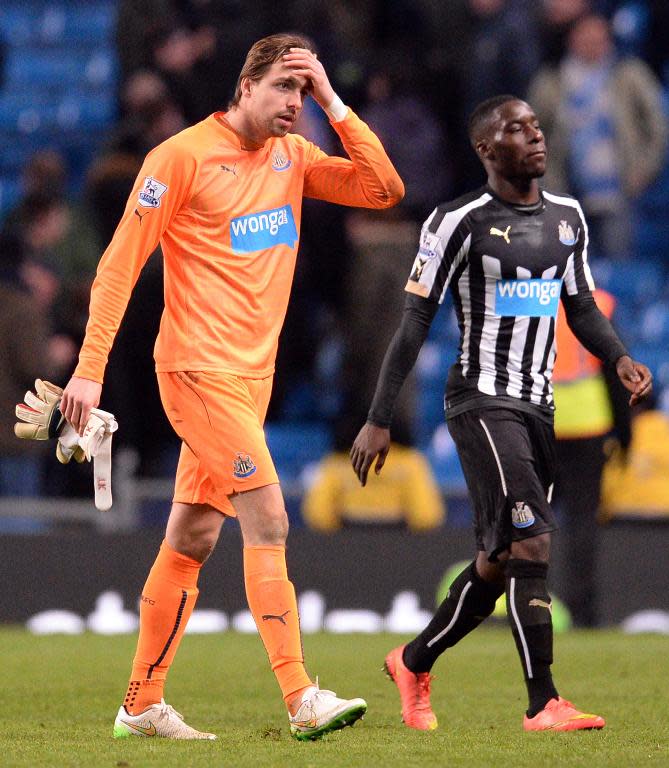 Newcastle United's goalkeeper Tim Krul (L) leaves the pitch with teammate Massadio Haidara following their 0-5 defeat to Manchester City, at The Etihad Stadium in Manchester, north-west England, on February 21, 2015