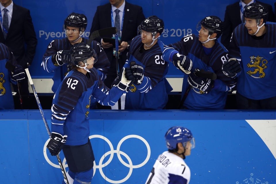 FILE - Miro Heiskanen (42), of Finland, celebrates with his teammates after scoring a goal against South Korea during the second period of the qualification round of the men's hockey game at the 2018 Winter Olympics in Gangneung, South Korea, Tuesday, Feb. 20, 2018. The 2018 Olympics without NHL talent offered a glimpse of things to come for players who hadn't yet reached the best hockey league in the world. (AP Photo/Jae C. Hong File)