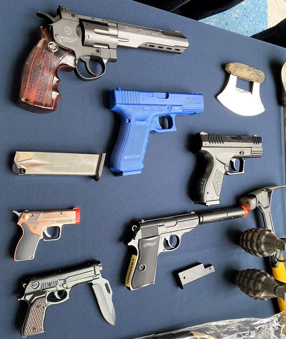 Replica handguns are also illegal to carry onboard a flight, such as these BB and pellet guns, one with a silencer (lower center), and even a switchblade hidden inside a fake handgun (lower left). They were confiscated at Jacksonville International Airport earlier this year.