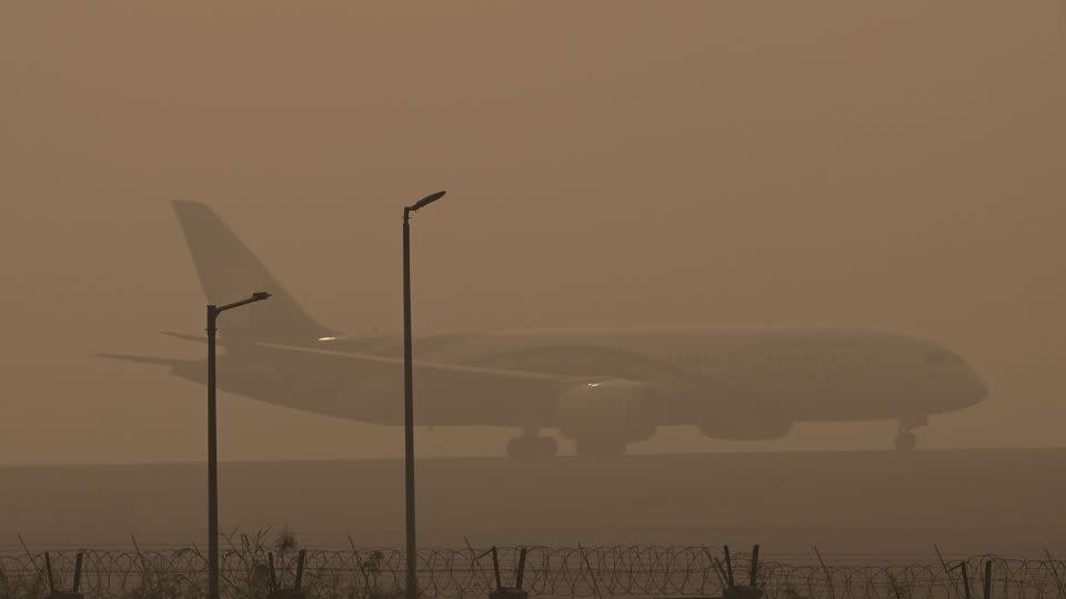 A passenger plane ready to take off at IGI Airport amid heavy smog on November 5, 2023 in New Delhi, India. - Vipin Kumar/Hindustan Times/Getty Images