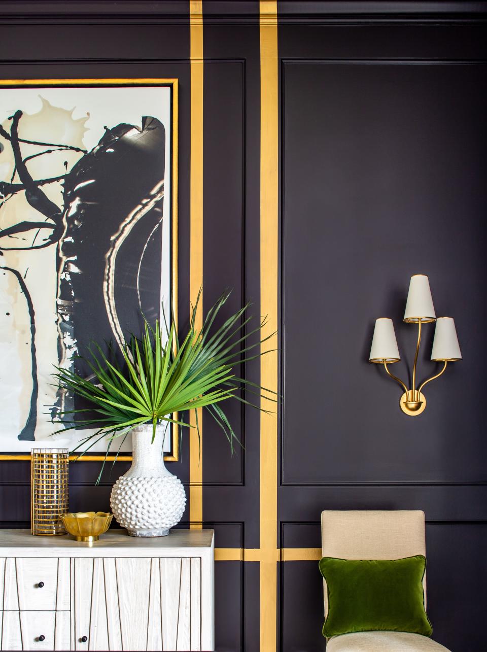 Gold stripes pop on the black walls.