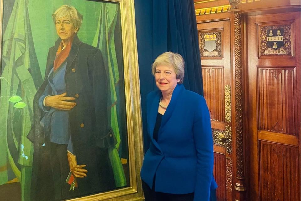 Theresa May with her portrait (Emily Prescott)