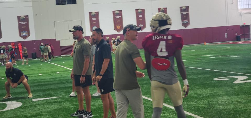 Florida State football head coach Mike Norvell coaching up freshman CB Charles Lester III during Wednesday's practice on Oct. 2, 2024.