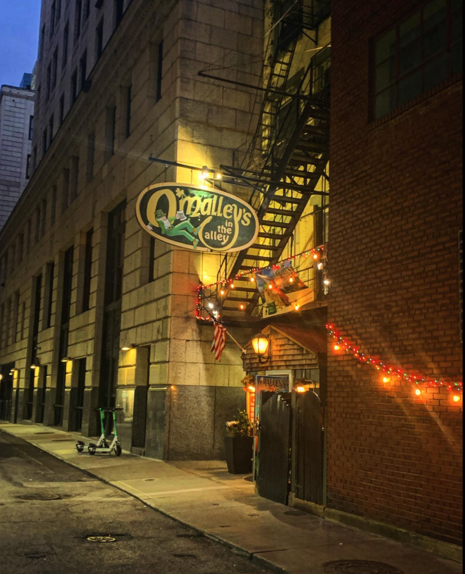 Grab a drink at O'Malley's in the Alley.