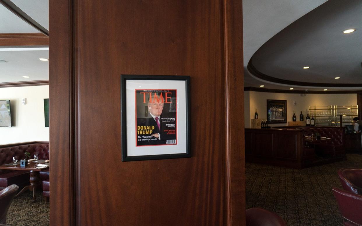 A framed fake Time Magazine cover hanging in the Champions Sports Bar & Grill at the Trump National Doral Miami, in Doral, Florida on June 24, 2017 - The Washington Post