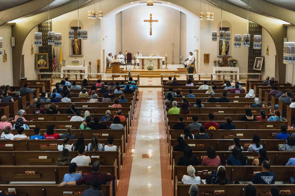 Mourners attend a vigil at Sacred Heart Catholic Church for victims of a mass shooting at Robb Elementary School on May 24, 2022, in Uvalde, Texas. According to reports, 19 students and 2 adults were killed before the gunman was fatally shot by law enforcement.