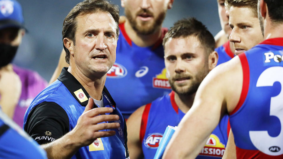 Luke Beveridge, pictured here addressing his players during the Western Bulldogs' clash with Geelong.