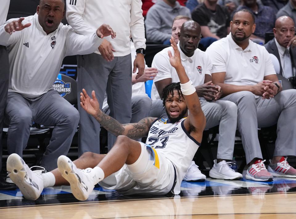 David Joplin looks to the officials to make a call during Marquette's game vs. North Carolina State on Friday night in the NCAA Tournament Sweet 16 in Dallas.