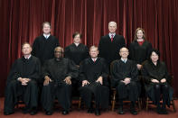 FILE - Members of the Supreme Court pose for a group photo at the Supreme Court in Washington, April 23, 2021. Seated from left are Associate Justice Samuel Alito, Associate Justice Clarence Thomas, Chief Justice John Roberts, Associate Justice Stephen Breyer and Associate Justice Sonia Sotomayor, Standing from left are Associate Justice Brett Kavanaugh, Associate Justice Elena Kagan, Associate Justice Neil Gorsuch and Associate Justice Amy Coney Barrett. Breyer is retiring, giving President Joe Biden an opening he has pledged to fill by naming the first Black woman to the high court, two sources told The Associated Press Wednesday, Jan. 26, 2022. (Erin Schaff/The New York Times via AP, Pool, File)