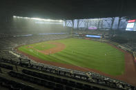 Smoke from wildfires fills the air at T-Mobile Park as the Seattle Mariners and the Oakland Athletics play with the roof extended during the sixth inning of the second baseball game of a doubleheader, Monday, Sept. 14, 2020, in Seattle. (AP Photo/Ted S. Warren)