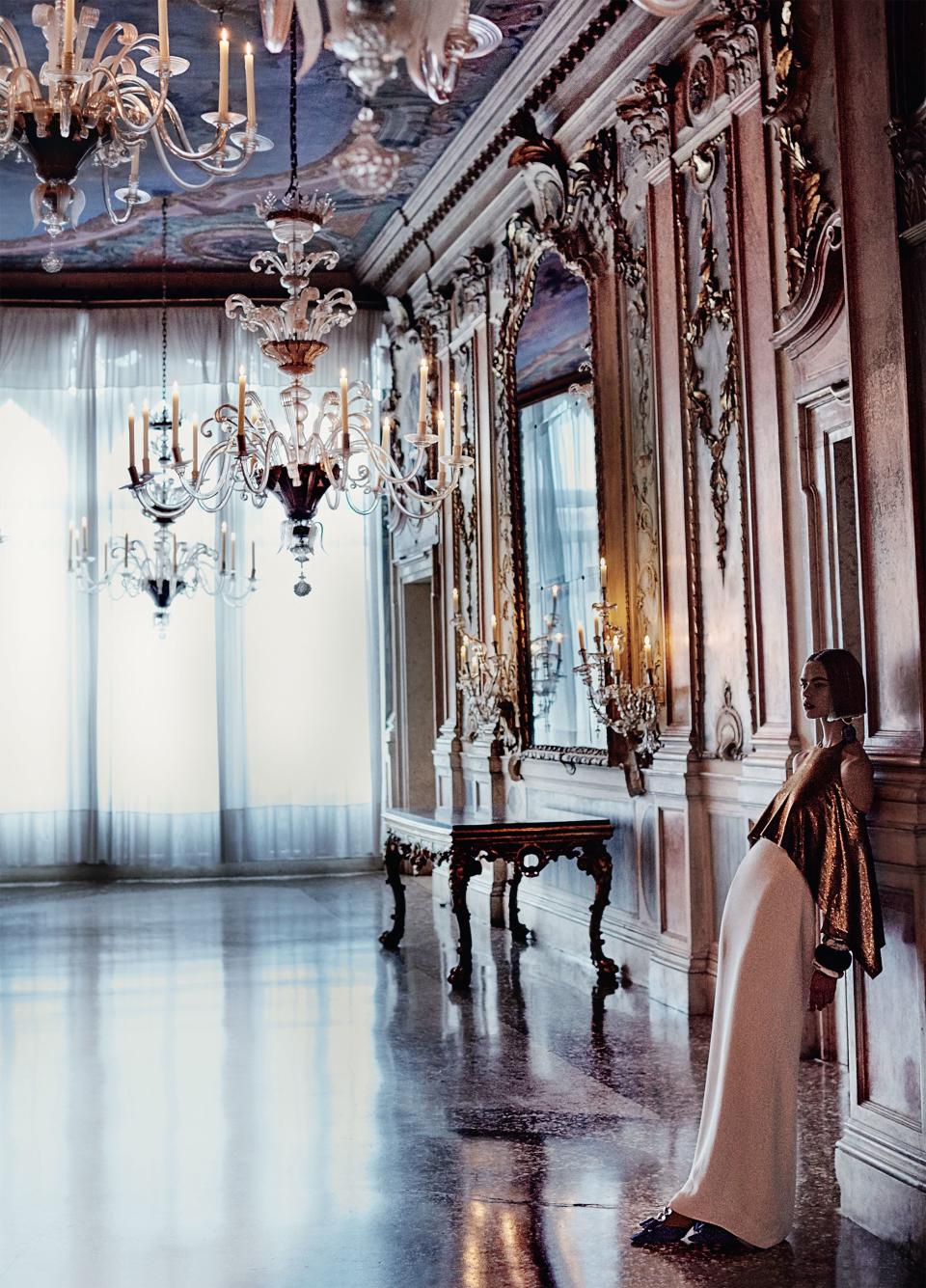 <strong>Gilded to Perfection</strong> Steal the spotlight in polished metallics that shine bright against the most ornamental Venetian backdrops. Ralph Lauren Collection dress, $4,390; select Ralph Lauren stores. Dinosaur Designs bangles.