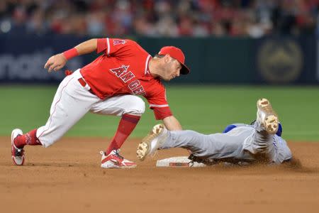 Jun 23, 2018; Anaheim, CA, USA; Los Angeles Angels second baseman Ian Kinsler (3) tags out Toronto Blue Jays catcher Russell Martin (right) as he attempts to steal second in the ninth inning at Angel Stadium of Anaheim. Mandatory Credit: Jake Roth-USA TODAY Sports