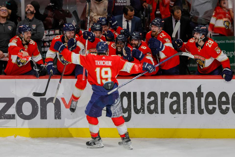 Florida Panthers forward Matthew Tkachuk celebrates with teammates after scoring the game-winning goal against the Carolina Hurricanes.