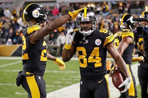 Pittsburgh Steelers wide receiver Antonio Brown celebrates his touchdown with Stevan Ridley, left, during the first half of an NFL football game against the Carolina Panthers - Credit: AP Photo/Keith Srakocic