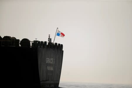 FILE PHOTO: A Panama flag flies on the stern of the Iranian oil tanker Grace 1 as it sits anchored after it was seized earlier this month by British Royal Marines in the Strait of Gibraltar