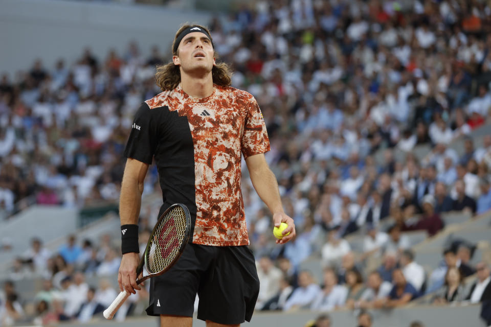 Greece's Stefanos Tsitsipas reacts after missing a shot against Spain's Carlos Alcaraz during their quarterfinal match of the French Open tennis tournament at the Roland Garros stadium in Paris, Tuesday, June 6, 2023. (AP Photo/Jean-Francois Badias)