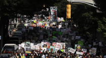 FILE - People march down the street towards the Georgia state Capitol to protest against the mistreatment of black people and to press for policy change, on June 15, 2020 in Atlanta. The NAACP, the nation's oldest civil rights organization said it will propose a sweeping plan meant to protect Black Americans from white supremacist violence, in response to a hate-fueled massacre that killed 10 Black people in Buffalo, New York last weekend.(AP Photo/Brynn Anderson, File)