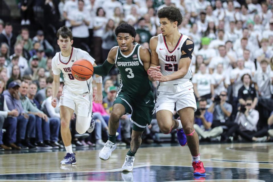 Michigan State guard Jaden Akins (3) dribbles against Southern Indiana guard AJ Smith (21) during the first half at Breslin Center in East Lansing on Thursday, Nov. 9, 2023.