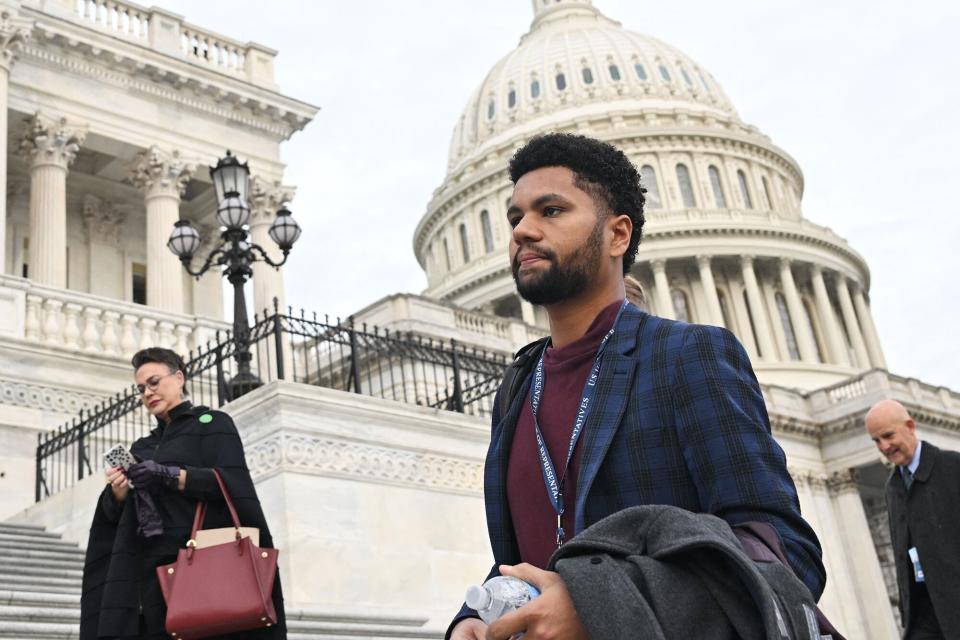 US House of Representatives member-elect Maxwell Frost (C), Democrat of Florida, arrives for a group photo with member-elect Harriet Hageman (L), Republican of Wyoming, outside of the US Capitol in Washington, DC on November 15, 2022.