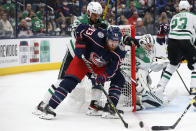 Columbus Blue Jackets' Jakub Voracek, front, tries to shoot against Dallas Stars' Braden Holtby, right, as Stars' Jamie Benn defends during the second period of an NHL hockey game Monday, Oct. 25, 2021, in Columbus, Ohio. (AP Photo/Jay LaPrete)