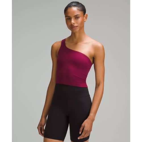 model wearing berry pink lululemon top with black bike shorts