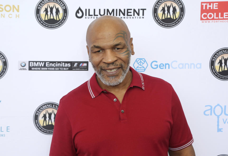 FILE - In this Aug. 2, 2019, file photo, Mike Tyson attends a celebrity golf tournament in Dana Point, Calif. Former heavyweight champion Mike Tyson is set to join the Professional Fighters League and host the new series “Mike Tyson’s New Fight Game: The PFL." Tyson will conduct interviews with fighters, and musicians, entertainers and other famous fans of mixed martial arts. (Photo by Willy Sanjuan/Invision/AP, File)