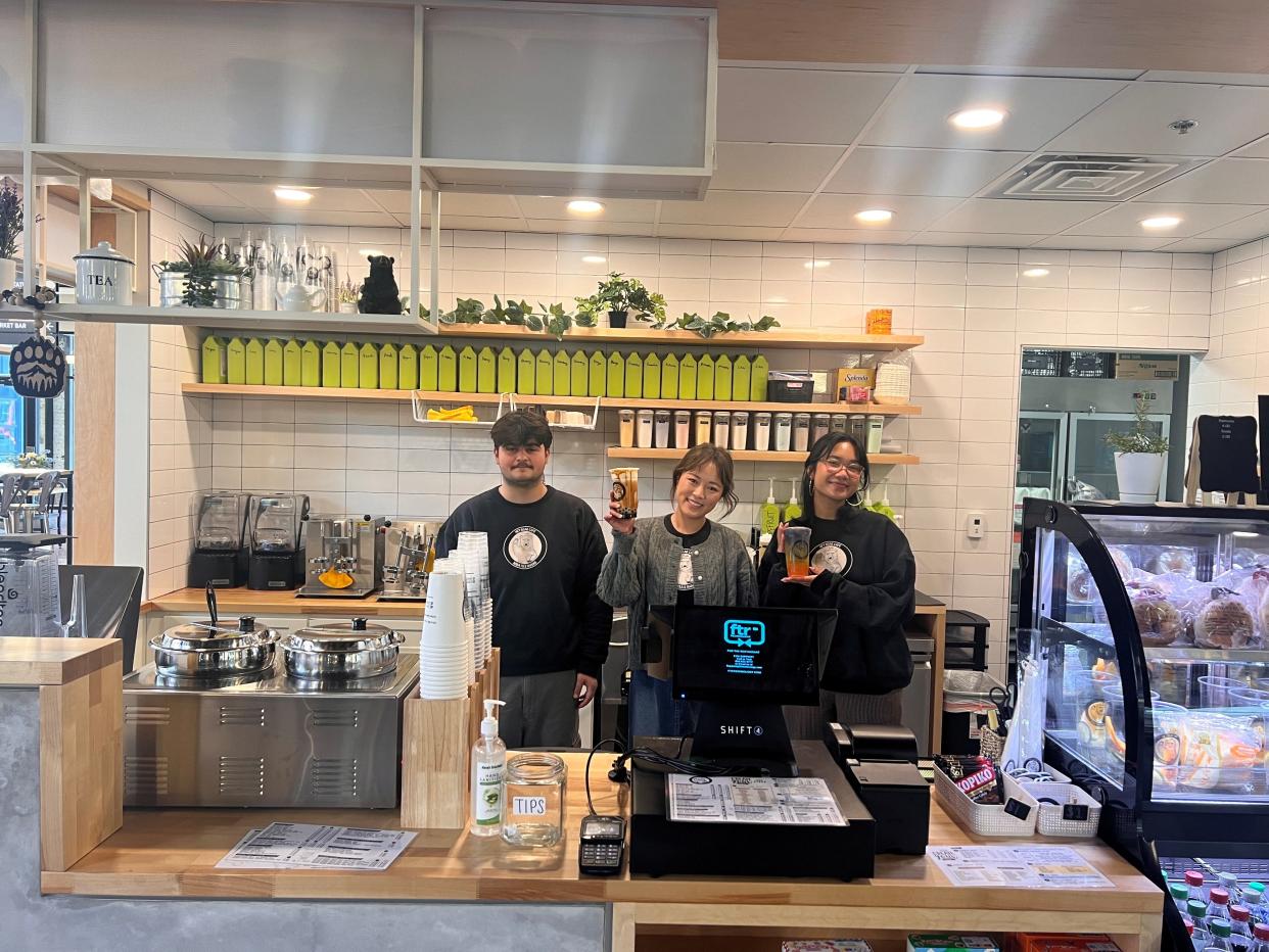 Hey Bear Cafe owner Vicky Shyr, middle, poses with employee Niko Malouhos, left, and manager Bopha Ek, right, and their boba creations.