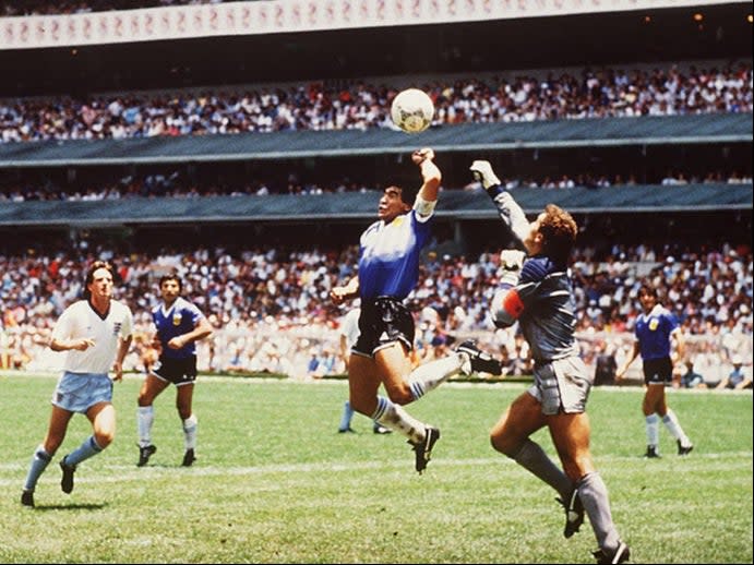 <p>Diego Maradona of Argentina handles the ball past Peter Shilton</p>Bongarts/Getty